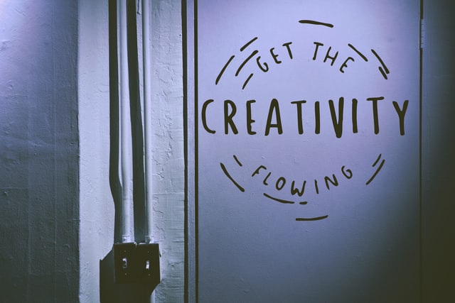 quote next to light switch that says "Get the creativity flowing"